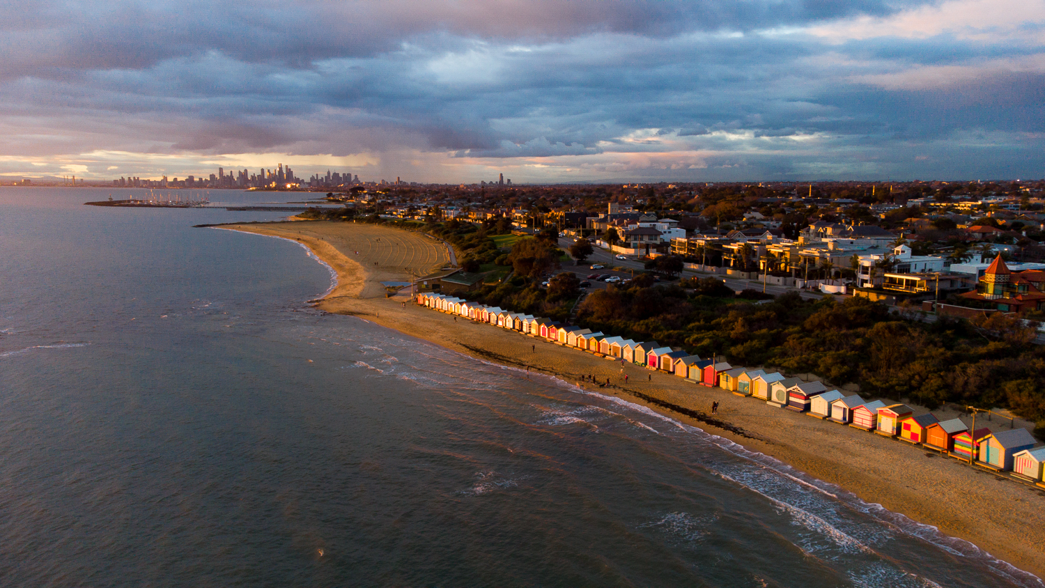 Commercial photo sample of a sunset over bathing boxes at Brighton Beach Melbourne. Photo taken from drone